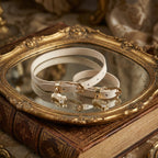 Matching accessory set including a soft pink leather choker necklace and coordinating items with gold hardware details