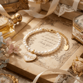 Luxury gift ready packaging shot of the Selviora Babygirl enamel pearl bracelet