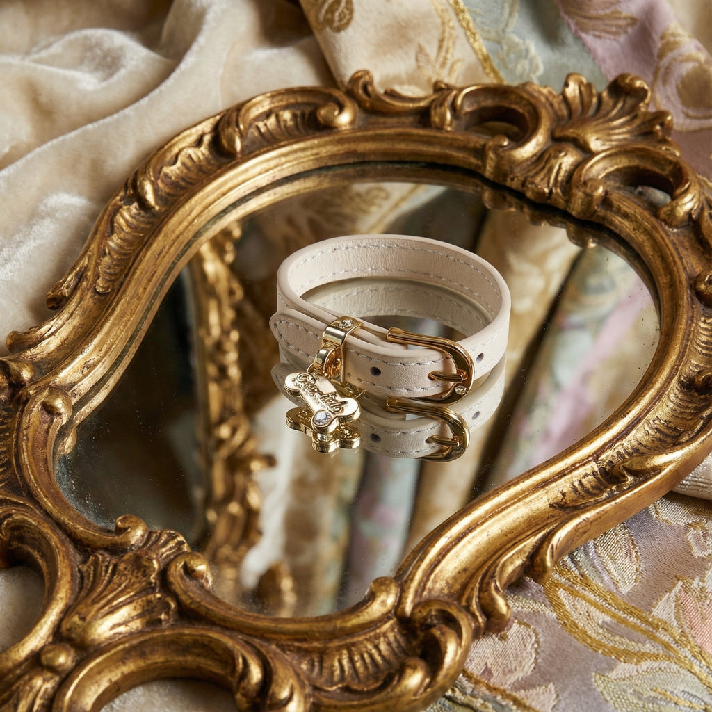 Cream calfskin leather choker with an 18k gold bone pendant