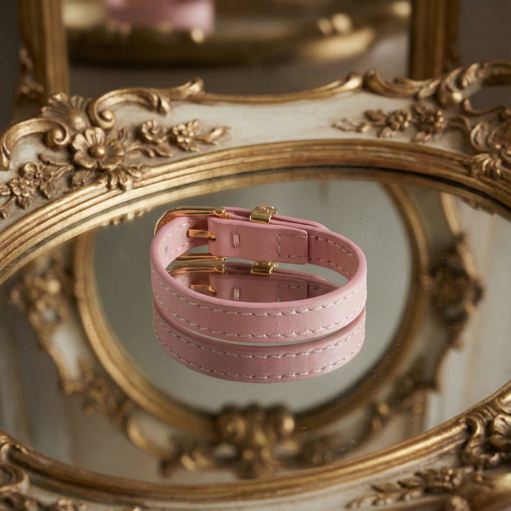 Detail shot focusing on the smooth finish and stitching of the blush pink genuine leather strap