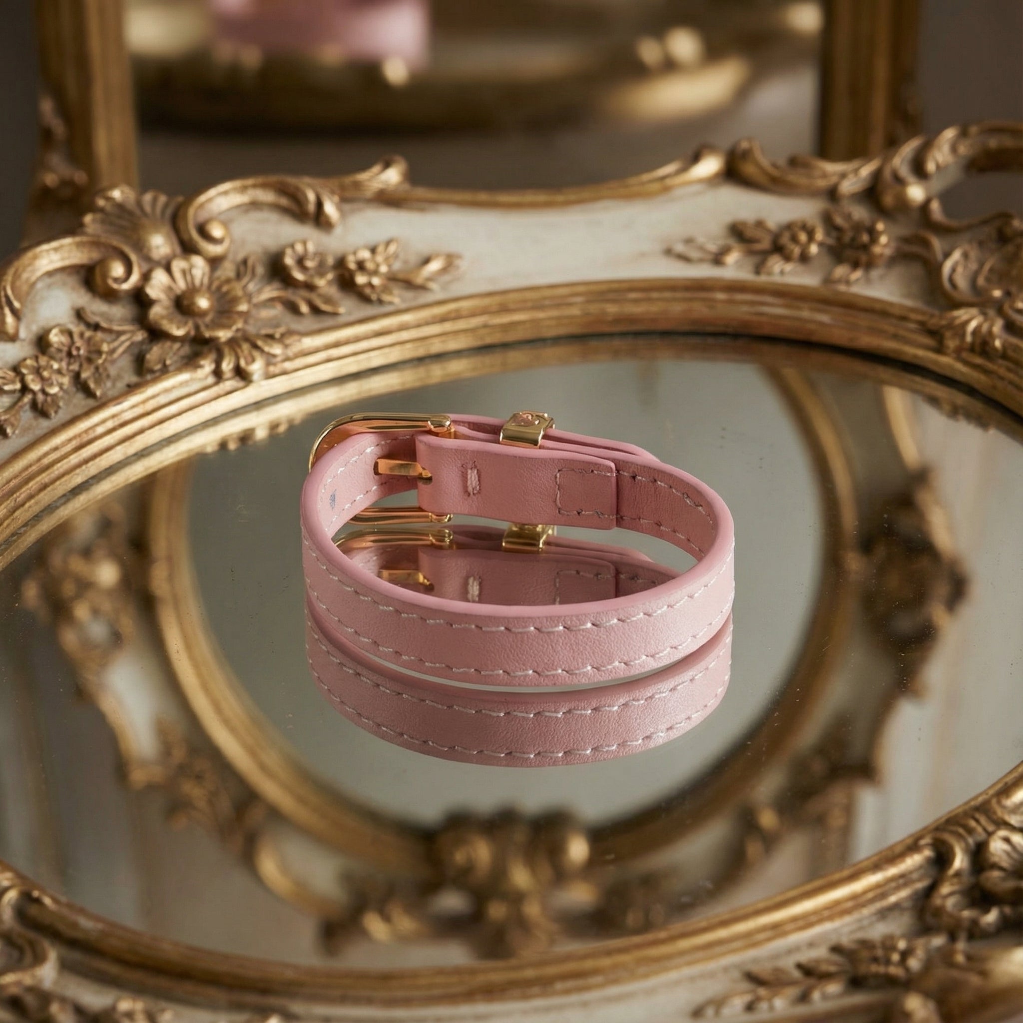 Detail shot focusing on the smooth finish and stitching of the blush pink genuine leather strap