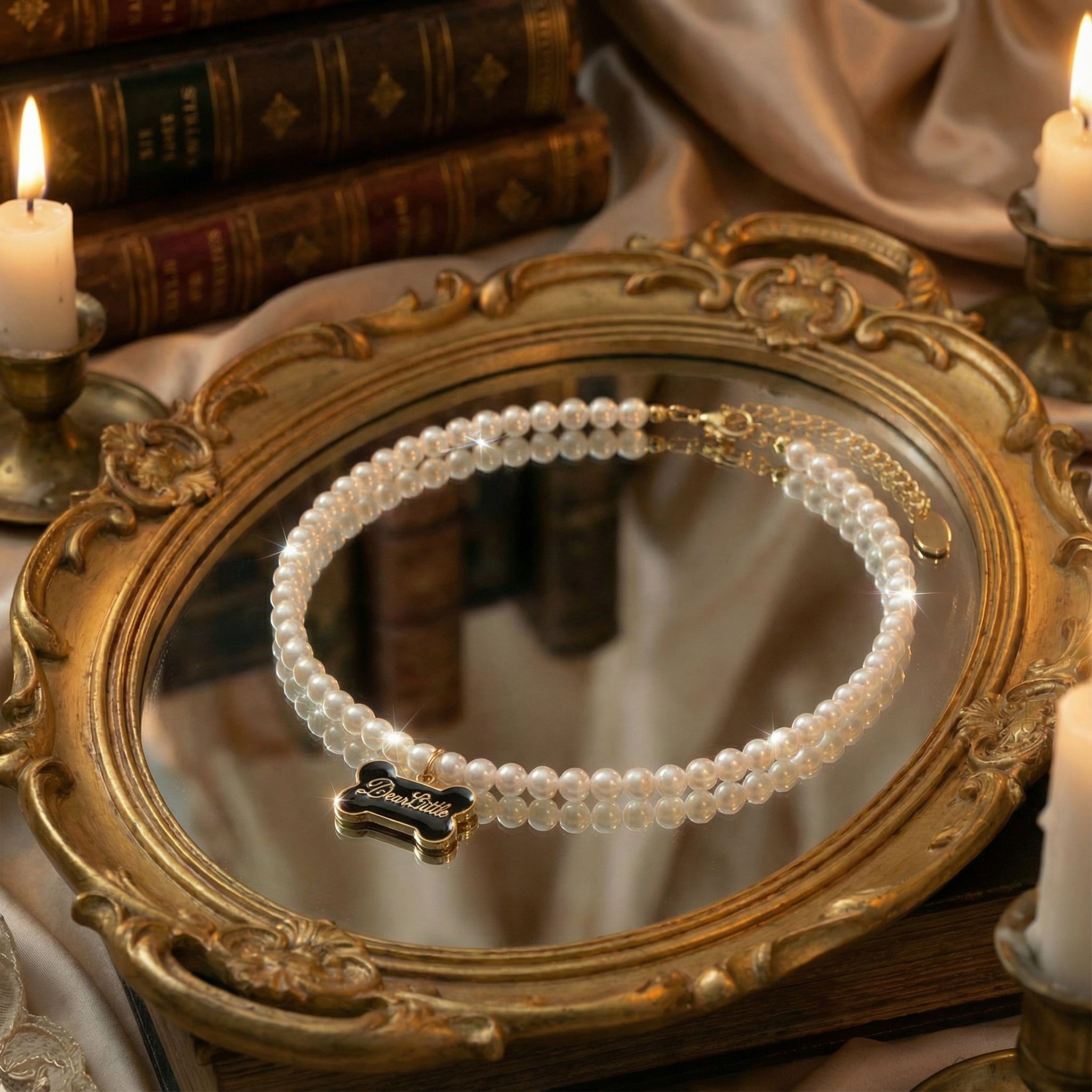 Overhead view of freshwater pearl necklace with a unique black enamel dog bone charm