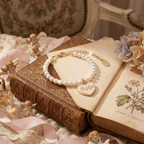 Styling inspiration: Gold and pearl bracelet stack featuring the signature Babygirl heart charm