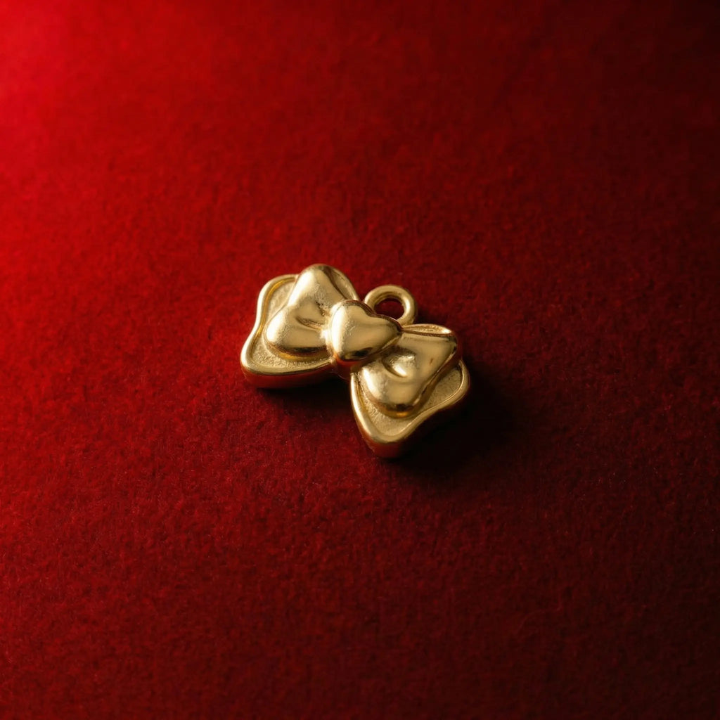 Coquette aesthetic jewelry Gold ribbon bow pendant with a cute heart center.