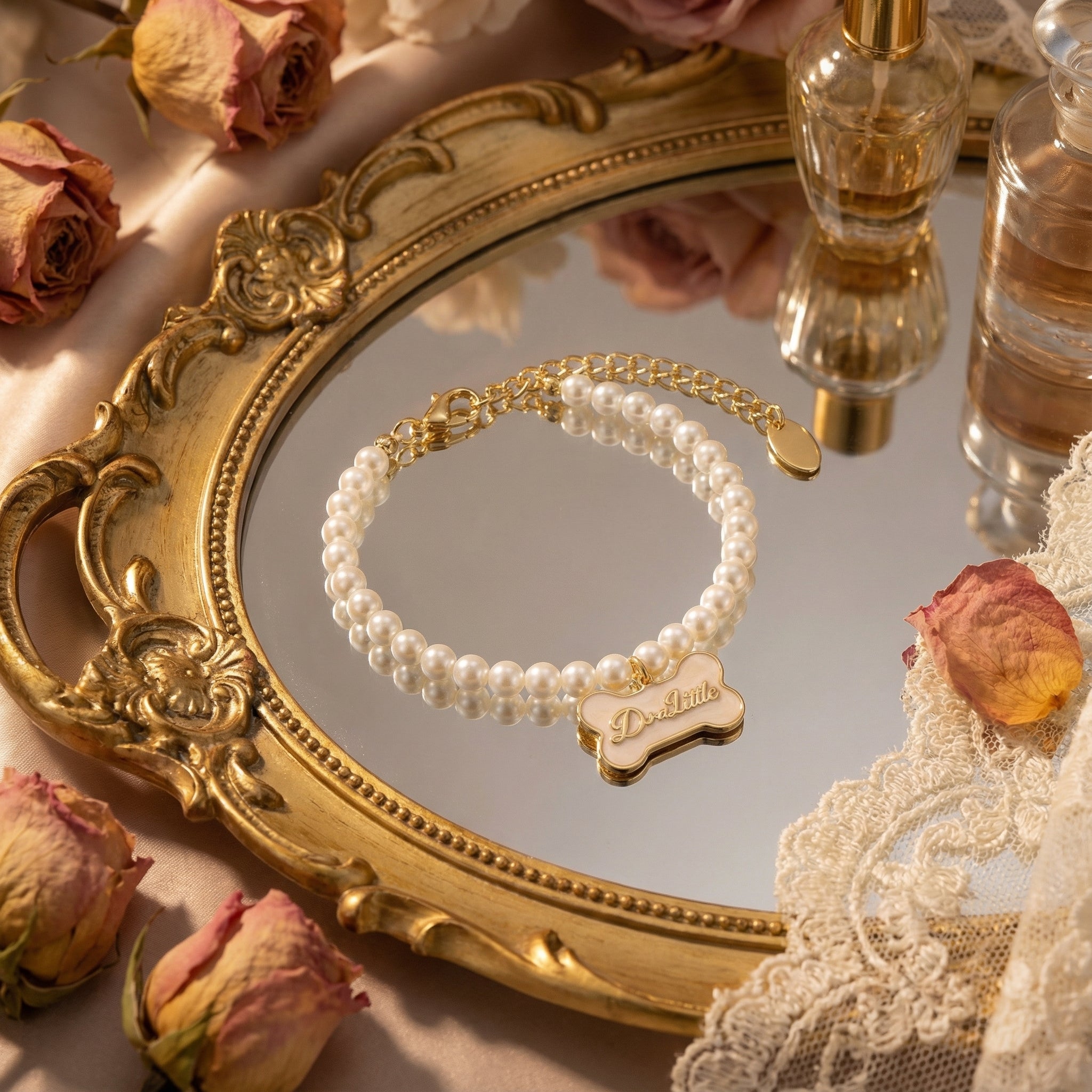 Detail shot showing natural luster of freshwater pearls contrasted with the smooth enamel texture of the charm