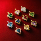 Close up of The Envy gothic heart shaped solid zirconia pendant in multicolor green, 18K gold plated brass charm for sliding chain necklace