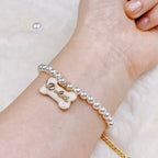 The Gilded Bone Rococo Pearl Bracelet(Beige Enamel Bone)  Selviora