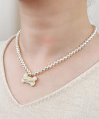 The Signature Freshwater Pearl Choker with Gold Enamel Charm(Beige Bone Pendant)  Selviora